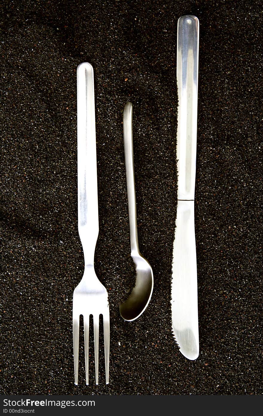 Spoon, Knife and Fork isolated in dark