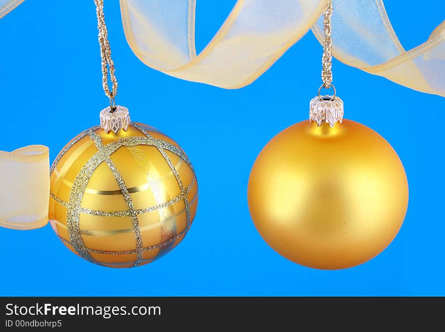 Golden decorative Christmas bauble isolated on blue backgrund. Golden decorative Christmas bauble isolated on blue backgrund