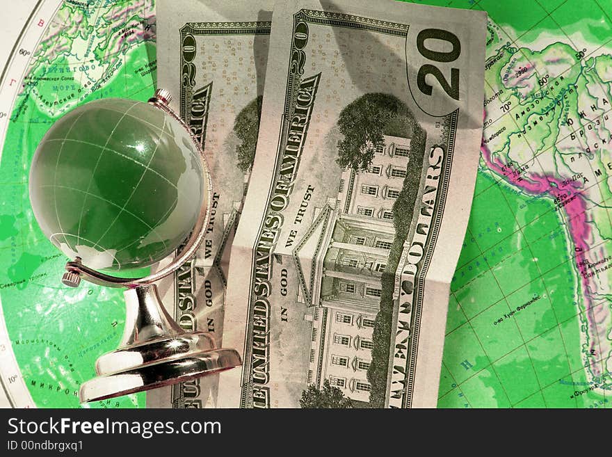 Banknote and globe on a background of a card