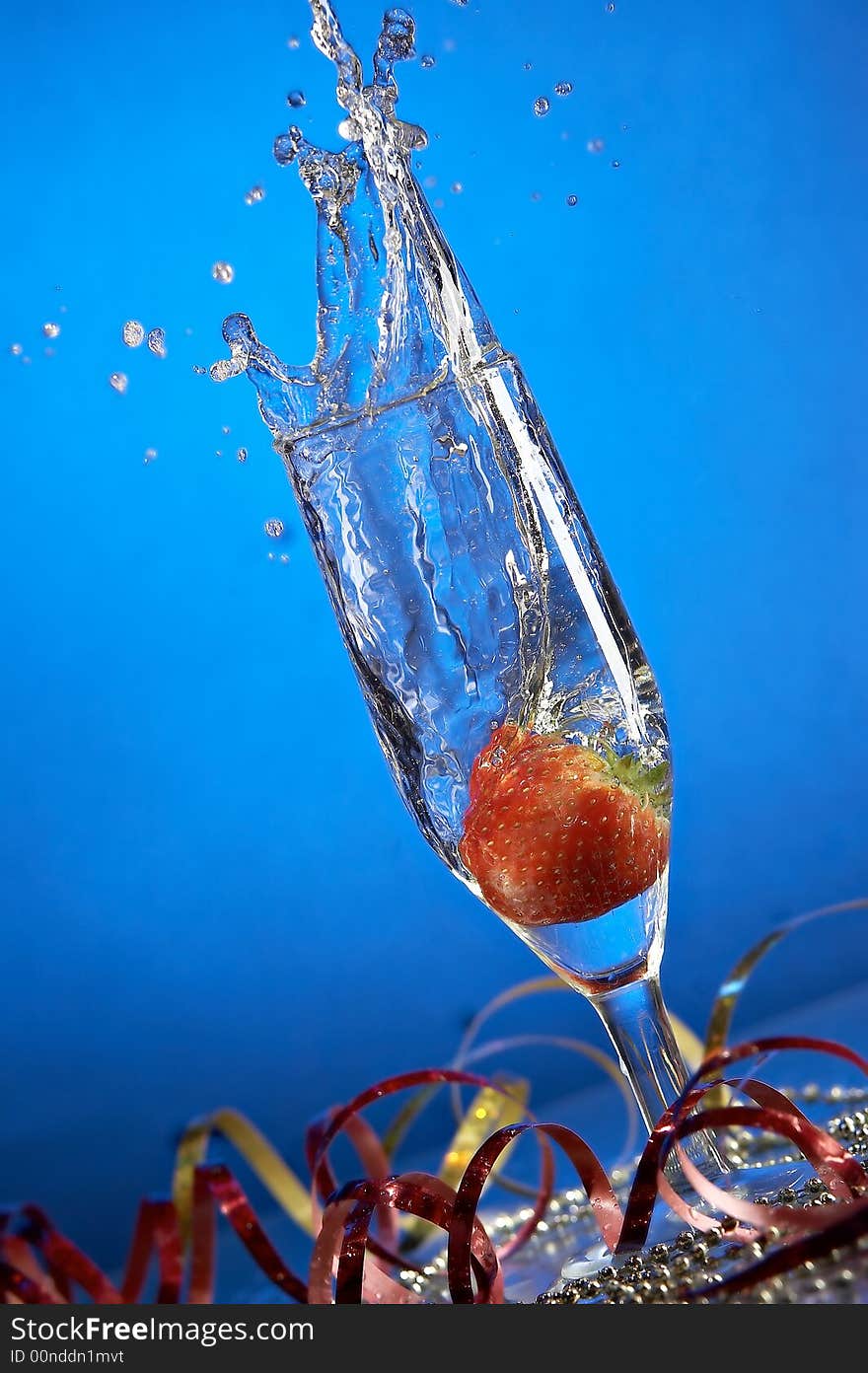 Still life with glass with champagne on the blue background