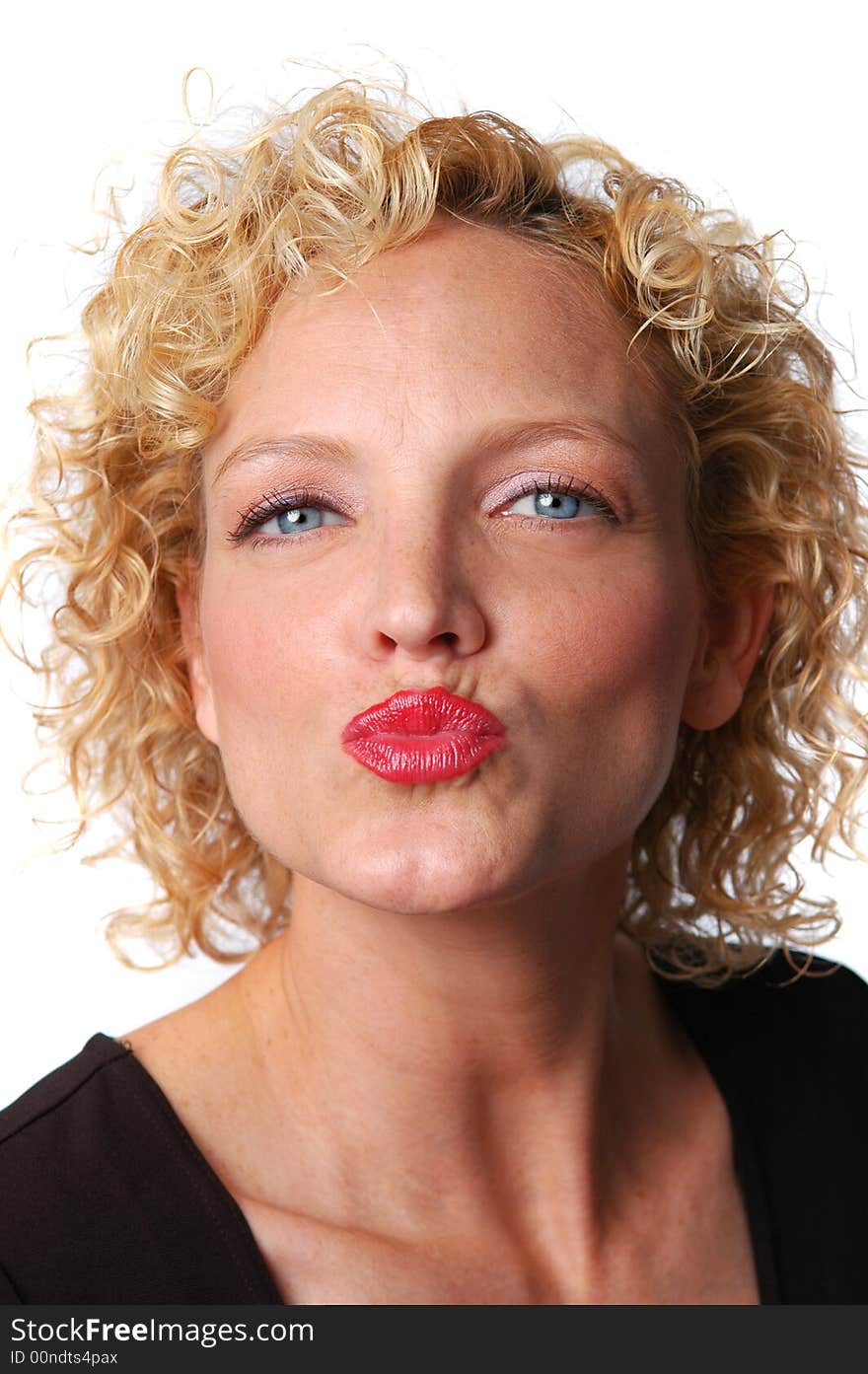 Portrait of woman kissing on a white background