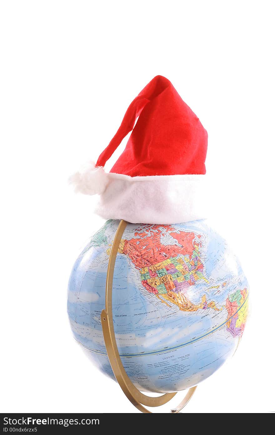 Shot of a globe with santa hat vertical