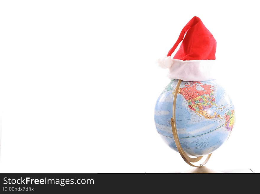 Shot of a globe with Santa hat