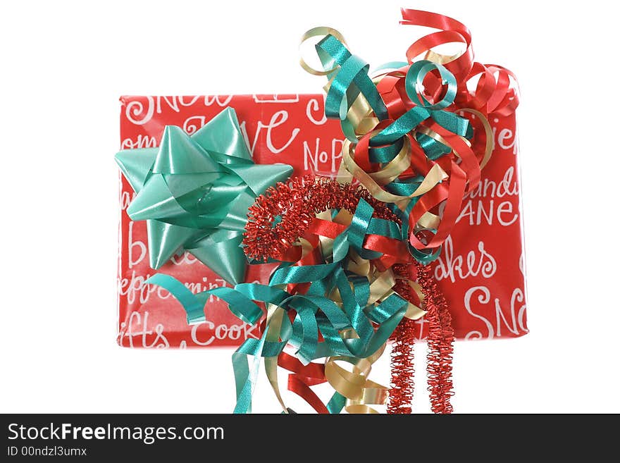 Photo of a Christmas present with ribbons upclose