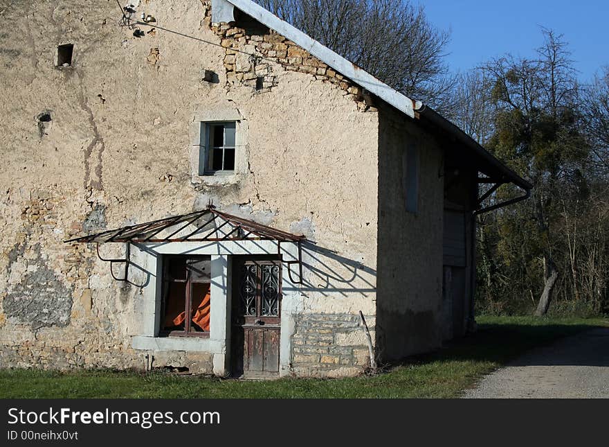 Side door of an old abandoned French farm house. Side door of an old abandoned French farm house.