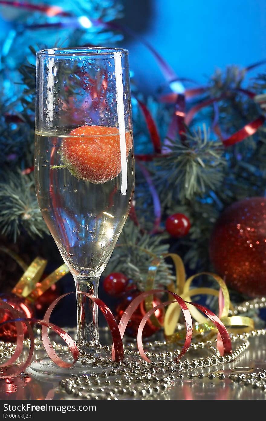 Still life with glass with champagne on the blue background