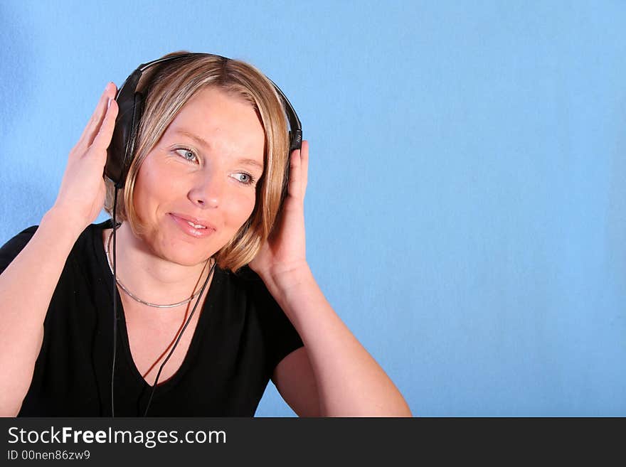 Young beautiful happy women listening music