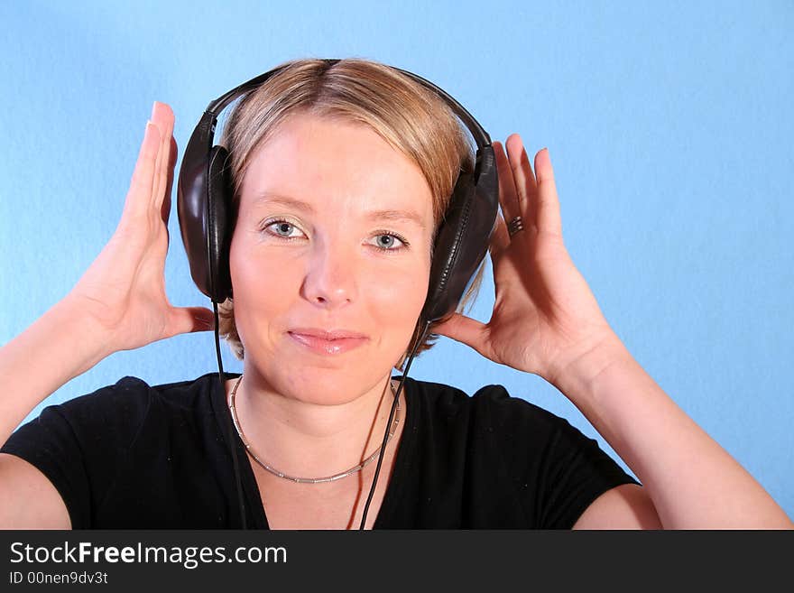 Young beautiful happy women listening music