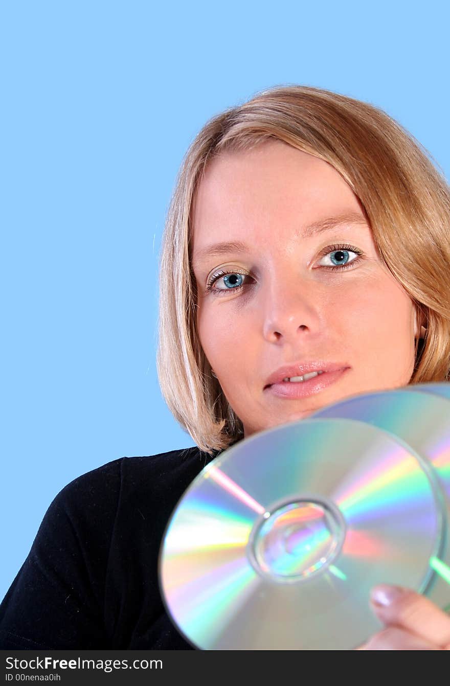 Young woman holding compact disc. Young woman holding compact disc