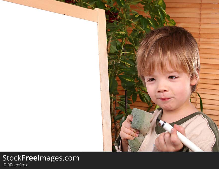 The boy drawing on a board