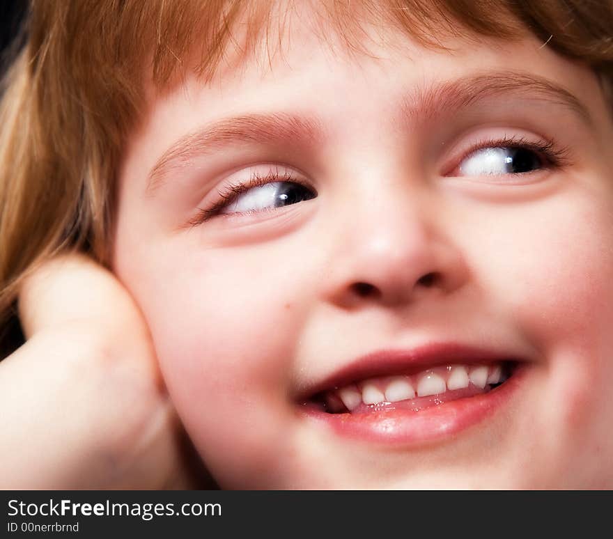 Face and hand only portrait of a cute little girl. Face and hand only portrait of a cute little girl.