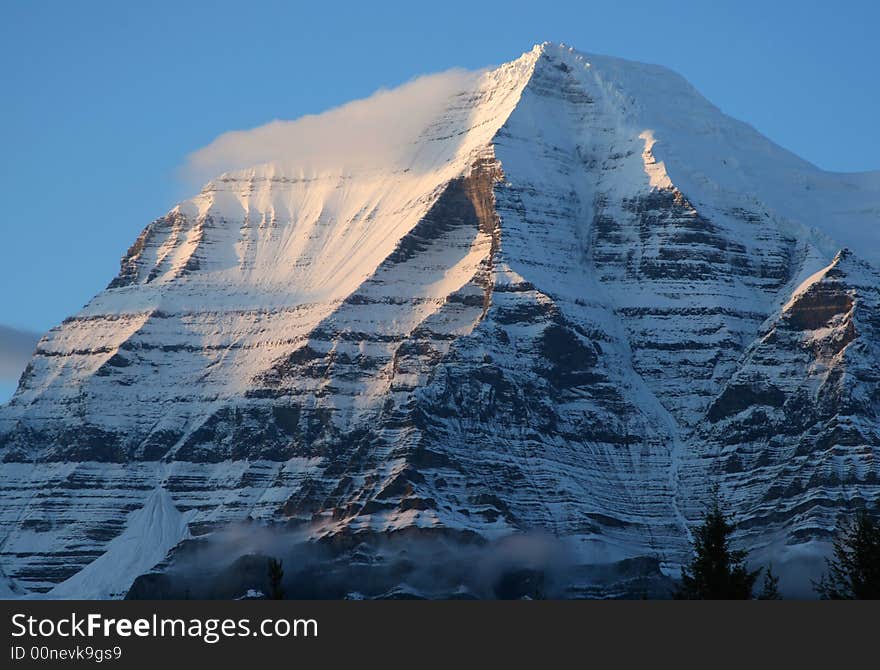 Early morning light on the summit of Mount Robson, B.C., Canada.