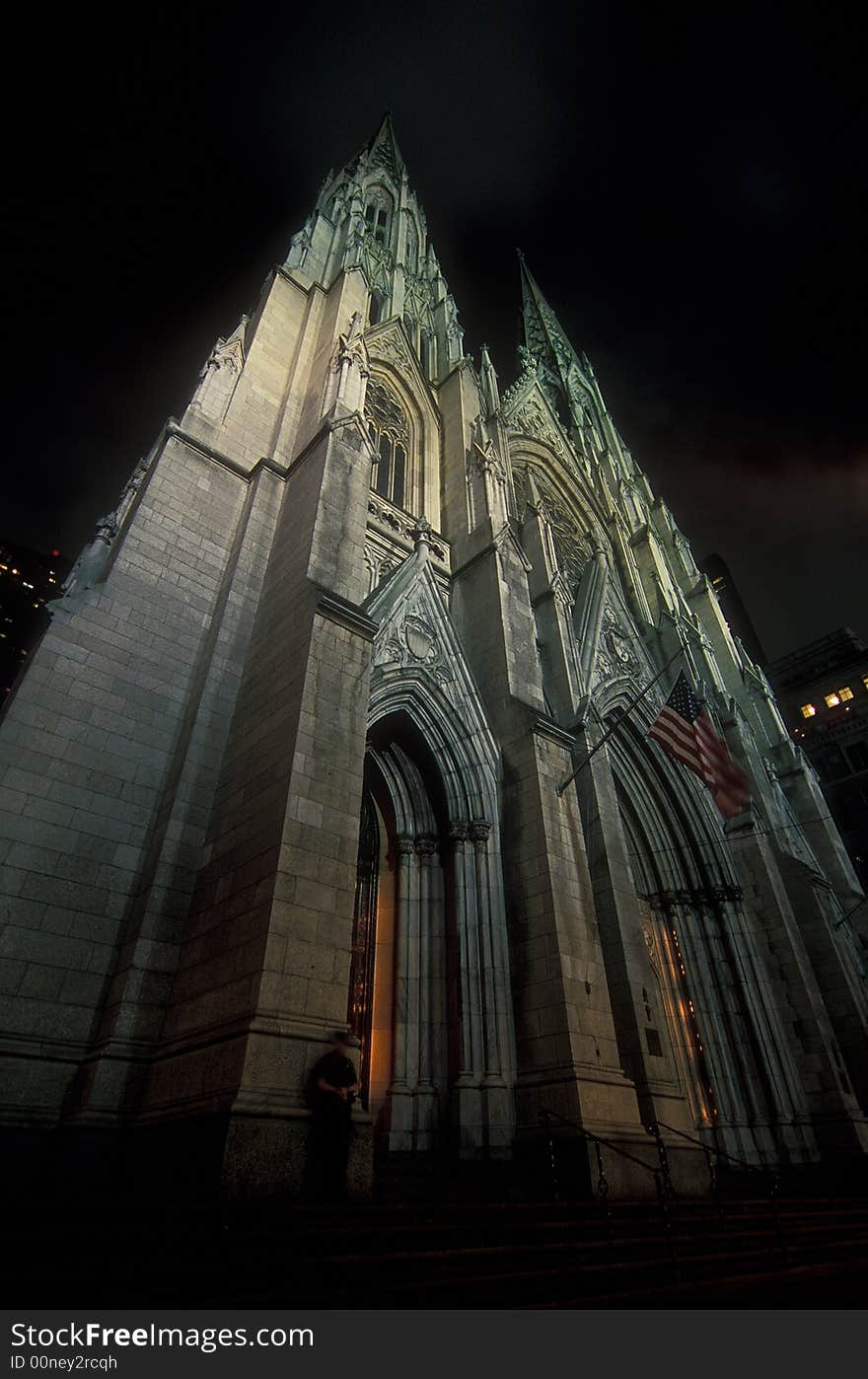 A church on 5th Avenue guarded by a policeman. A church on 5th Avenue guarded by a policeman