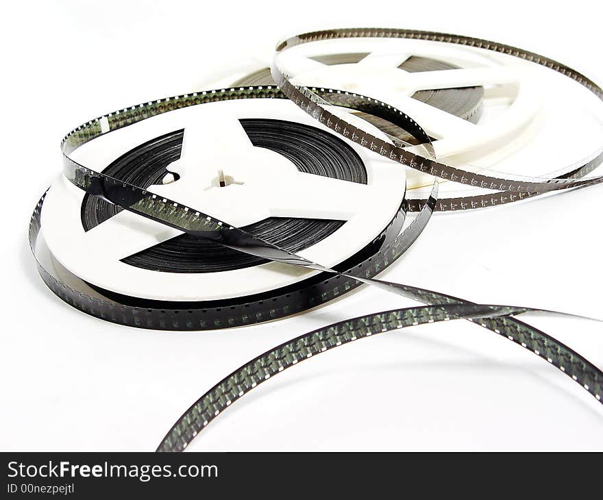 Two reels of old film strip on the white background. Two reels of old film strip on the white background