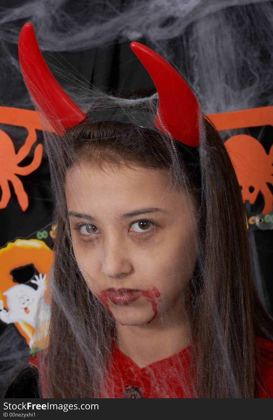 A young female dressed in a halloween costume