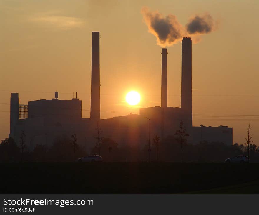 A power station at sunset. A power station at sunset.