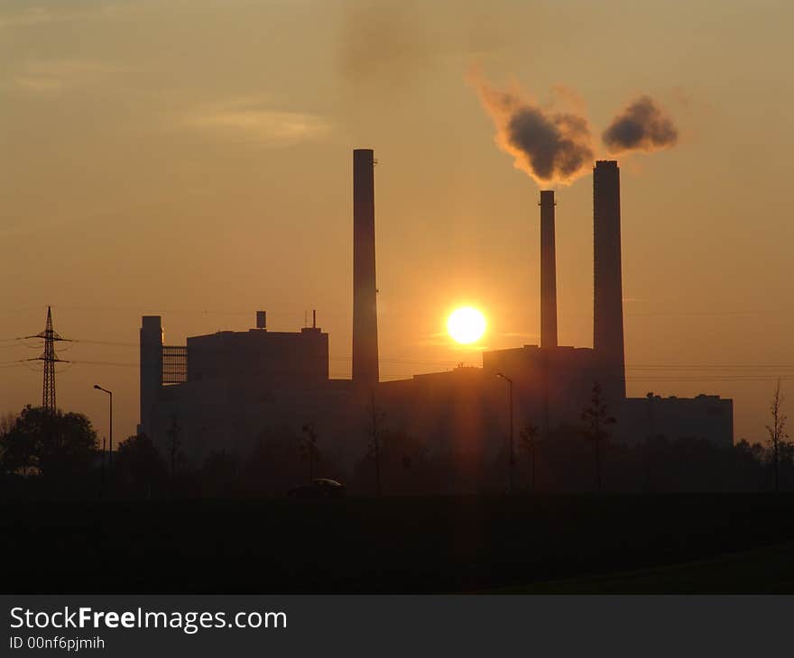 A power station at sunset. A power station at sunset.