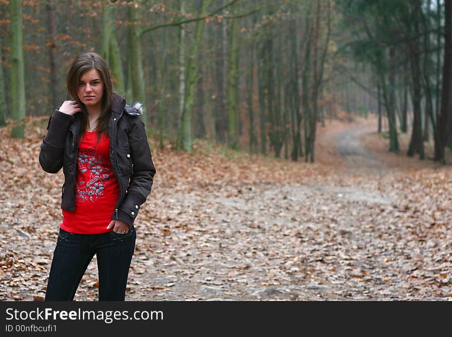 Young girl walking in the forest. Young girl walking in the forest