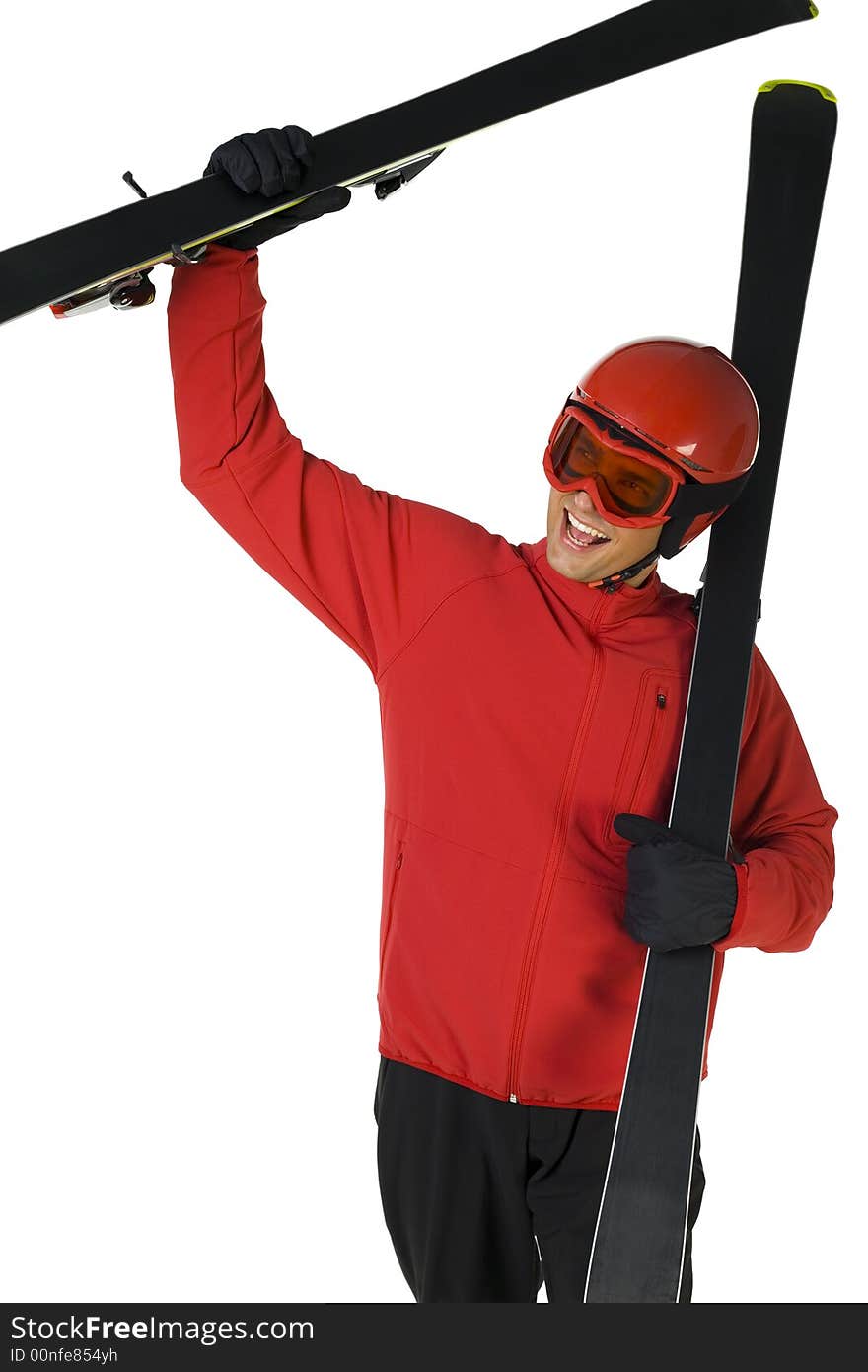 Happy skier holding skis in hands. He's on white background. Happy skier holding skis in hands. He's on white background