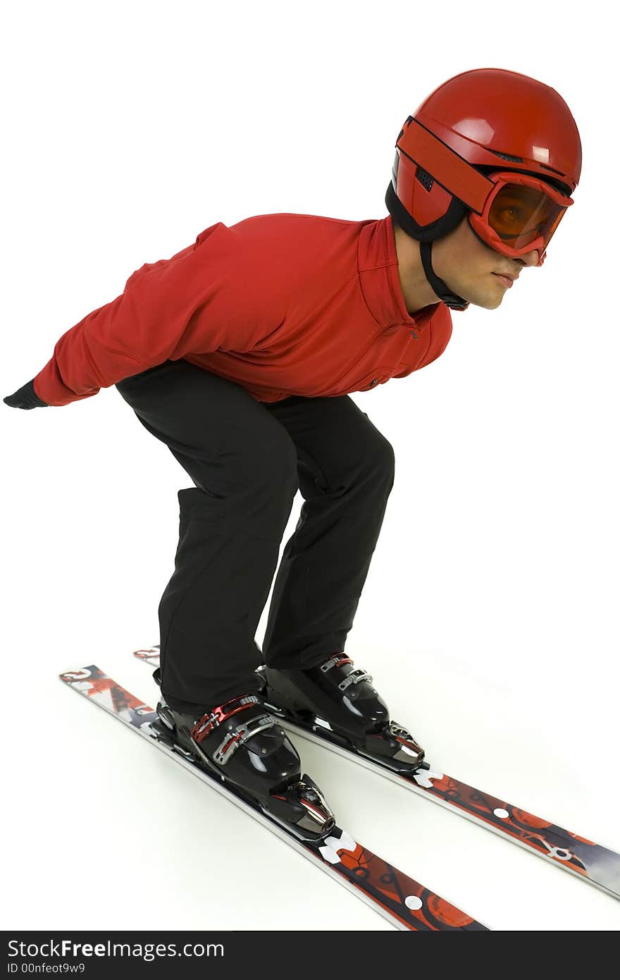 Young man dressed ski jumper's overall preparing to the jump. He's on white background. Young man dressed ski jumper's overall preparing to the jump. He's on white background