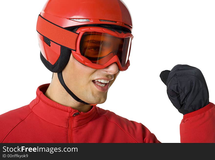 Young skier dressed red ski-clothes with clanched fist. He's on white background. Young skier dressed red ski-clothes with clanched fist. He's on white background.