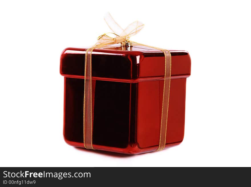 A gift wrapped in yellow and red on a white background