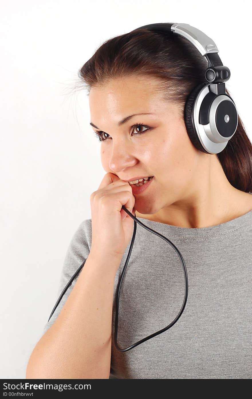 Photo of attractive brunette woman with headphones on white background. Photo of attractive brunette woman with headphones on white background