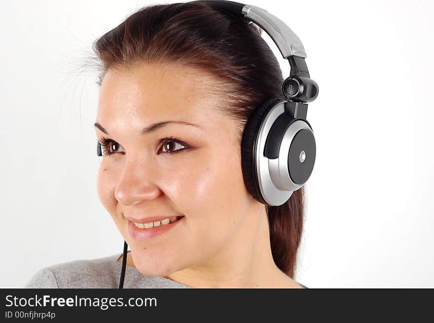 Photo of attractive brunette woman with headphones on white background. Photo of attractive brunette woman with headphones on white background