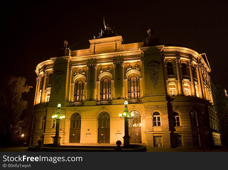 Night scene: awe viwe of Warsaw Politechnika in Poland. 1900 years building illuminated by light