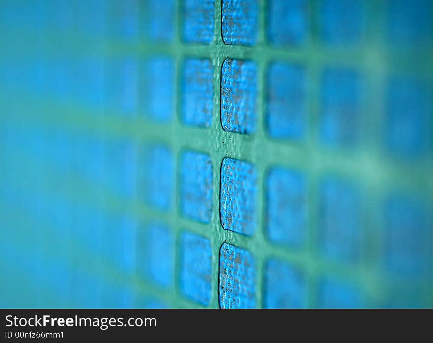 A close up image of a blue and green grid. A close up image of a blue and green grid