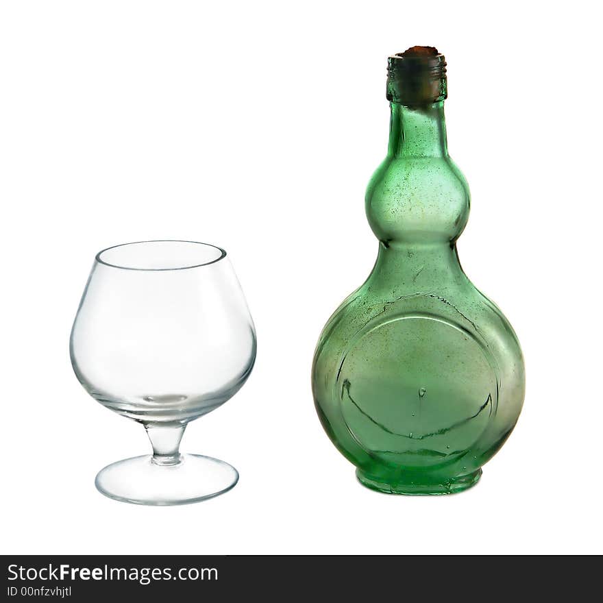 Small wine bottle and glass on white background