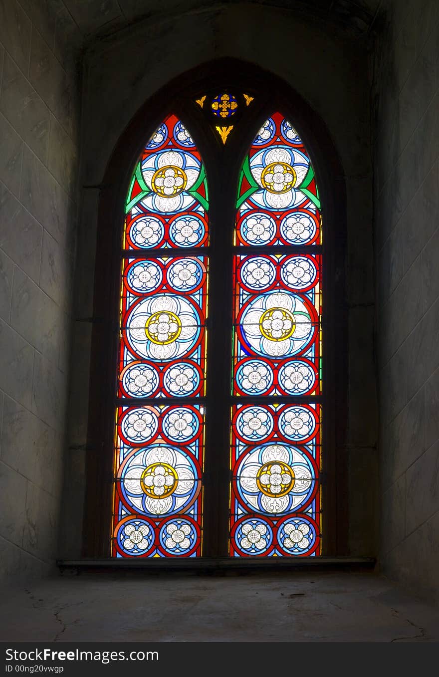 Stained glass of church window in a old chapel. Stained glass of church window in a old chapel.