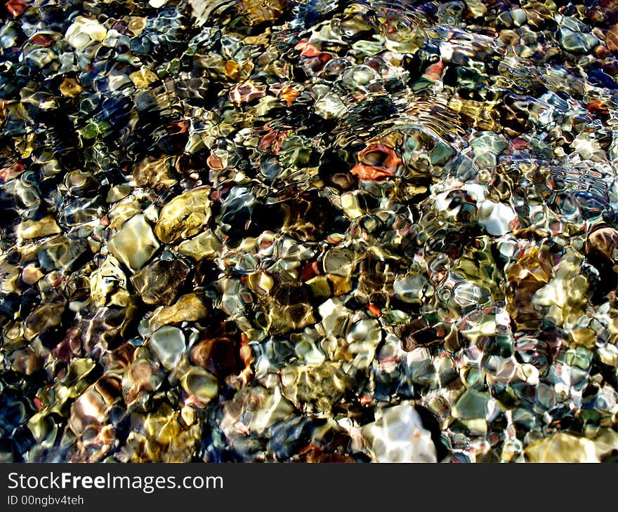 Colorful Rocks in a rippling stream