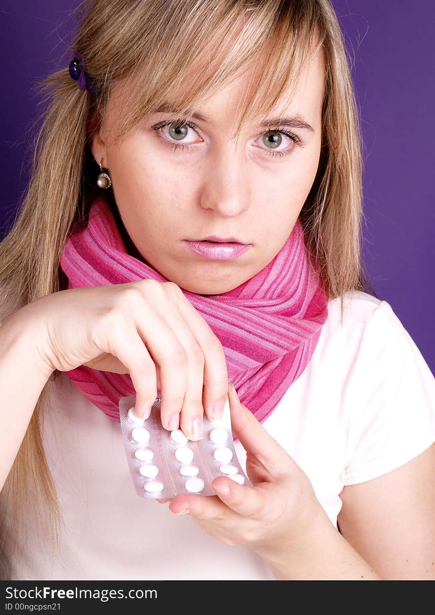 Portrait of  beautiful woman with tablets on her hand