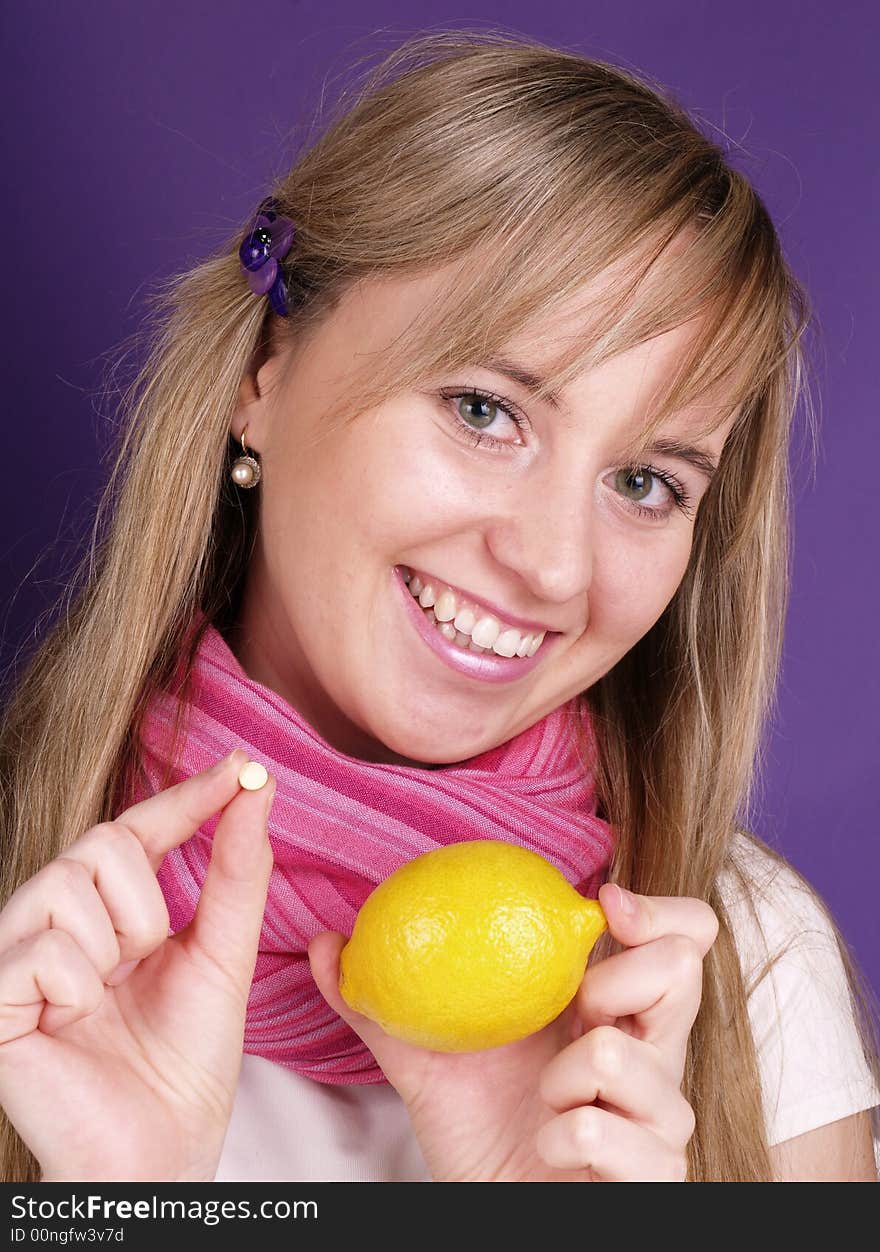 Young woman with lemon in hand