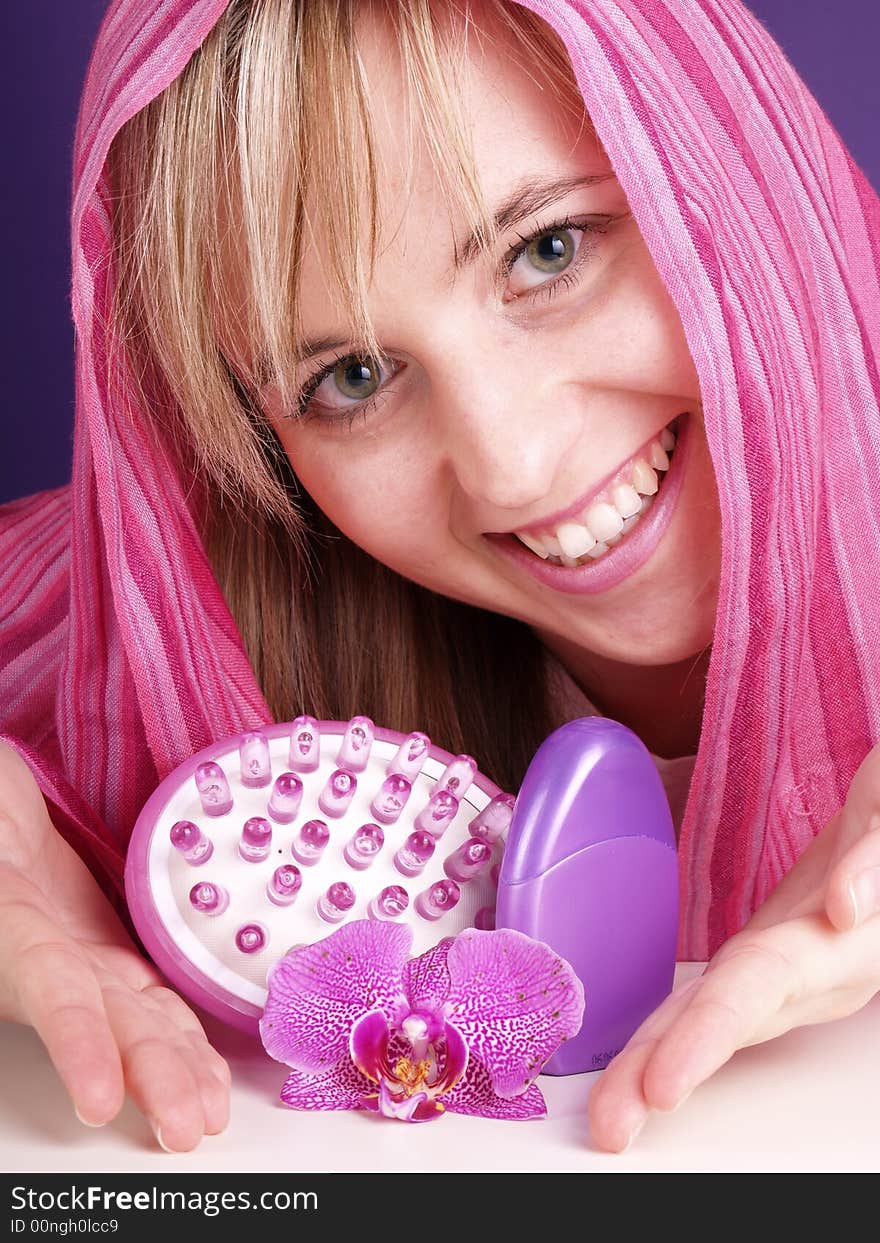 Smiling young woman; spa wellness scene.