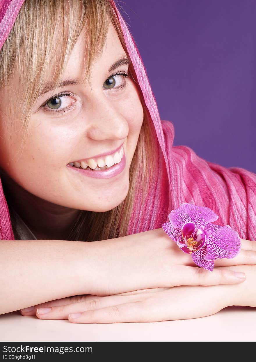 Beautiful girl with pink orchid