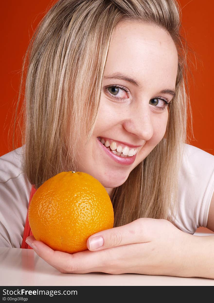 Young woman with orange