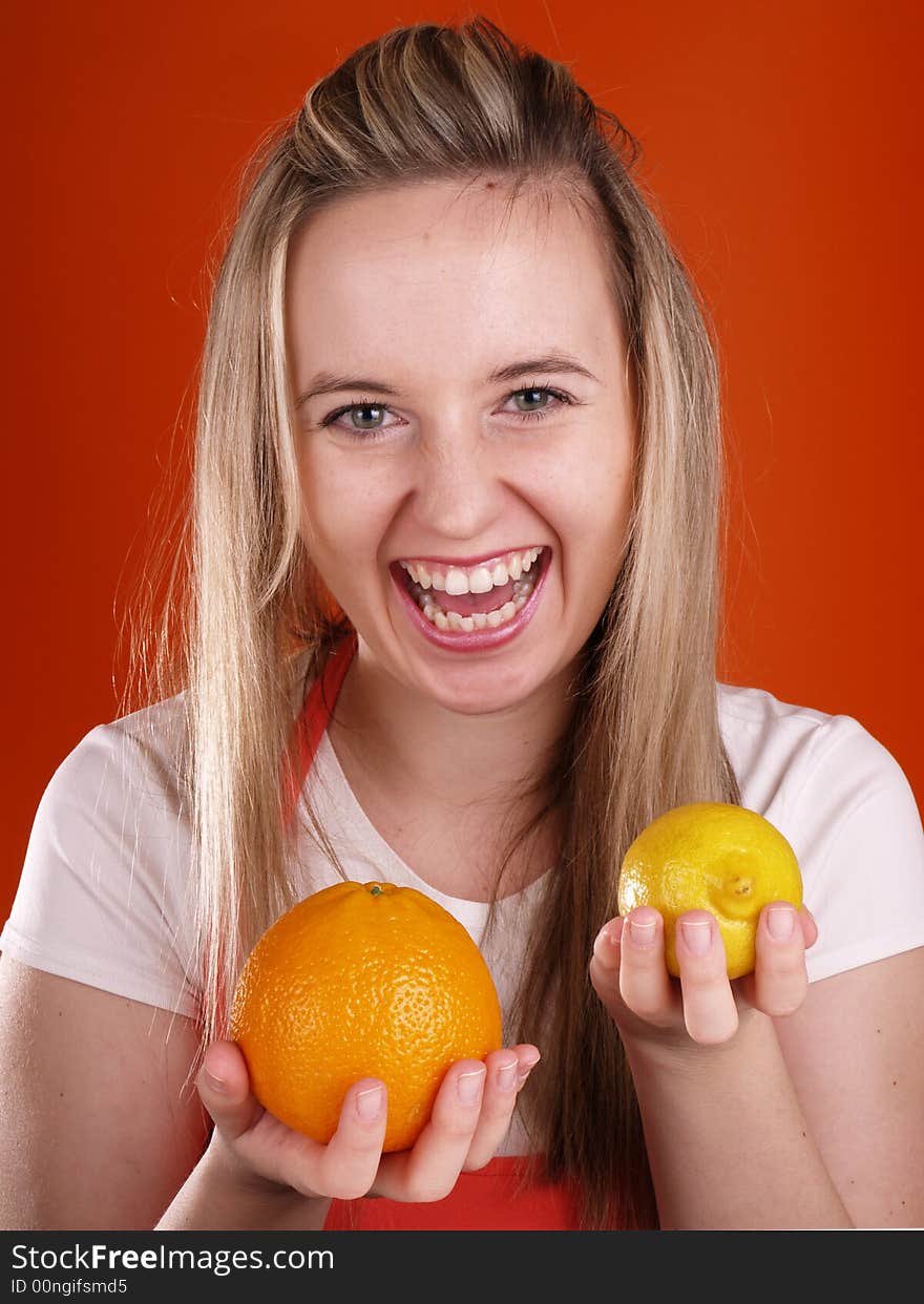 Happy woman with orange and lemons. Happy woman with orange and lemons.