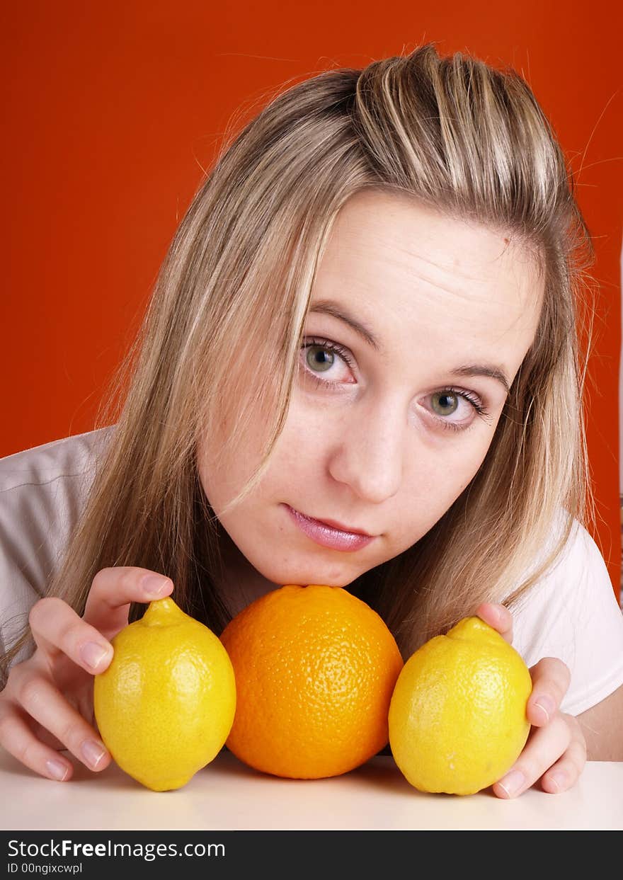 Young blond woman with fruits.