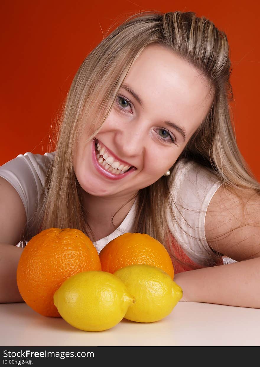 Smiling cute girl with fruits