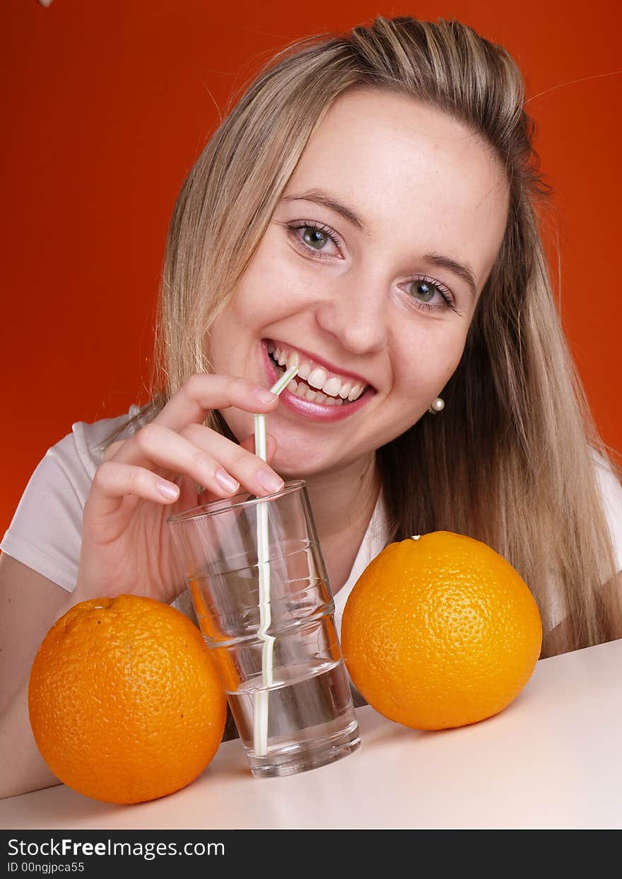 Blond girl drinking mineral water. Blond girl drinking mineral water.