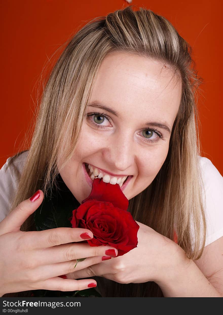 Beautiful has fun with red rose. Beautiful has fun with red rose.