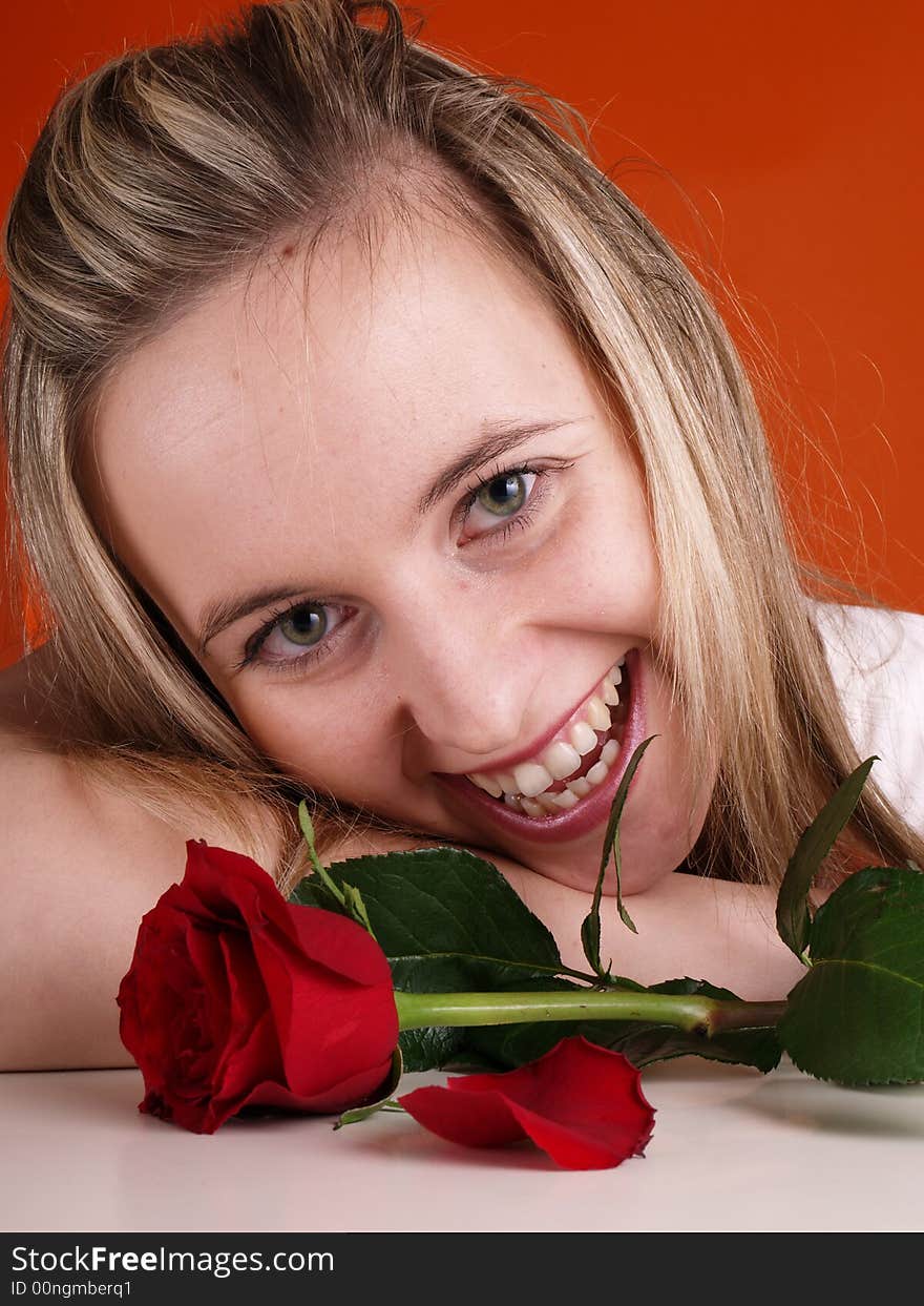 Smilling cute girl with red rose. Smilling cute girl with red rose