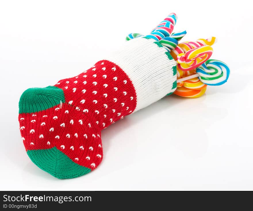 A christmas stocking with lollipop candies inside. A christmas stocking with lollipop candies inside