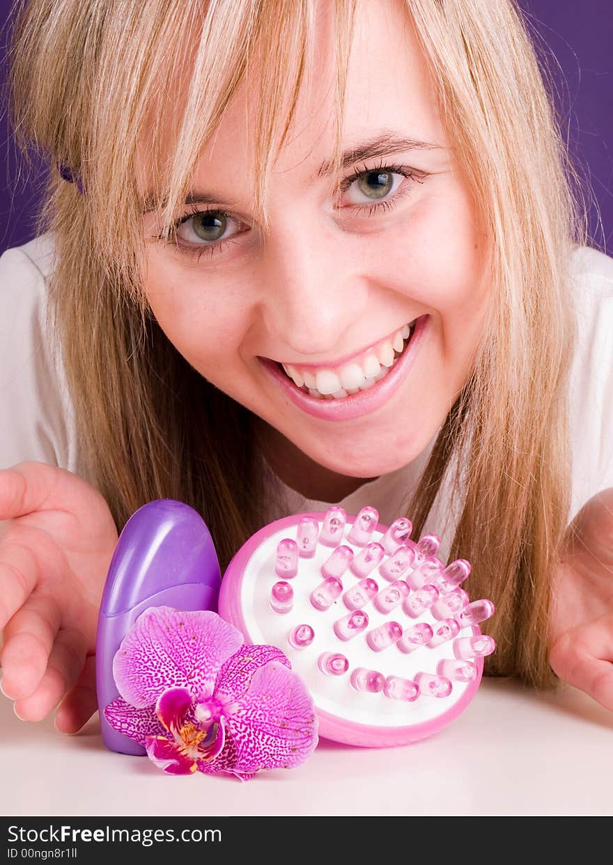 Smiling woman with orchid