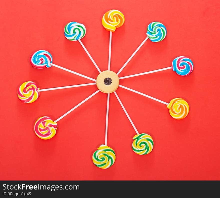 Twirl lollipop candies over a white background