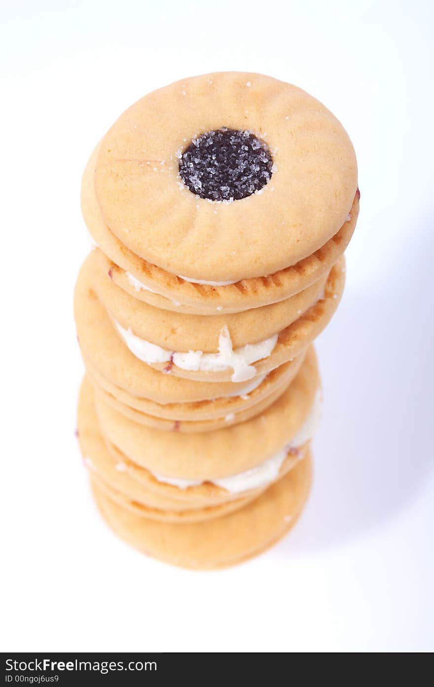 Stack of tasty biscuits over a white background