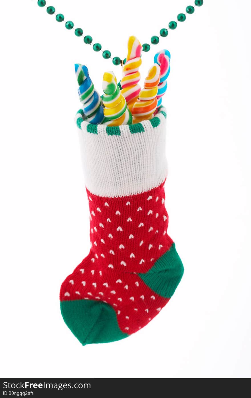 A christmas stocking with lollipop candies inside. A christmas stocking with lollipop candies inside