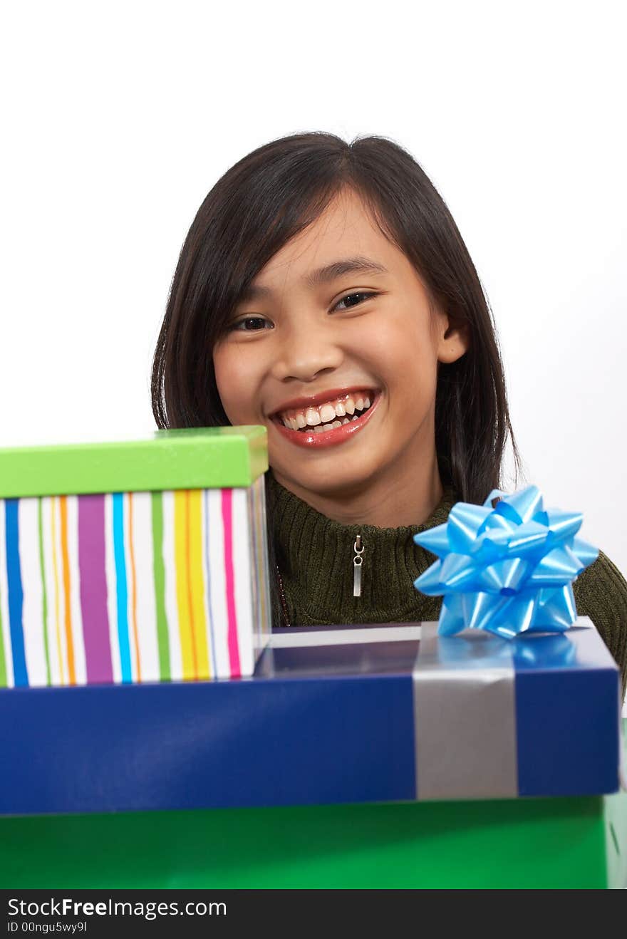 A happy young girl with christmas presents